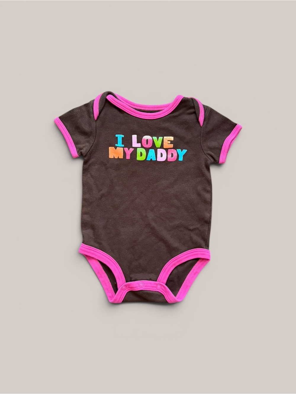 Y2K Carter’s brown onesie w “I love my daddy” in rainbow sparkly graphic letters